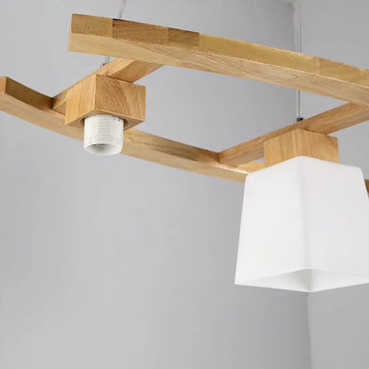Minimalist wood and ivory glass pendant light dining room