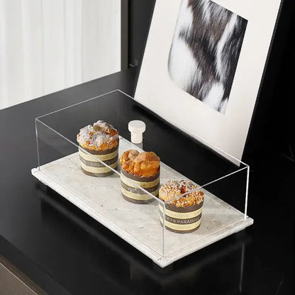 Modern acrylic display case with travertine base for dining room
