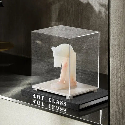 Modern acrylic display case with travertine base for dining room