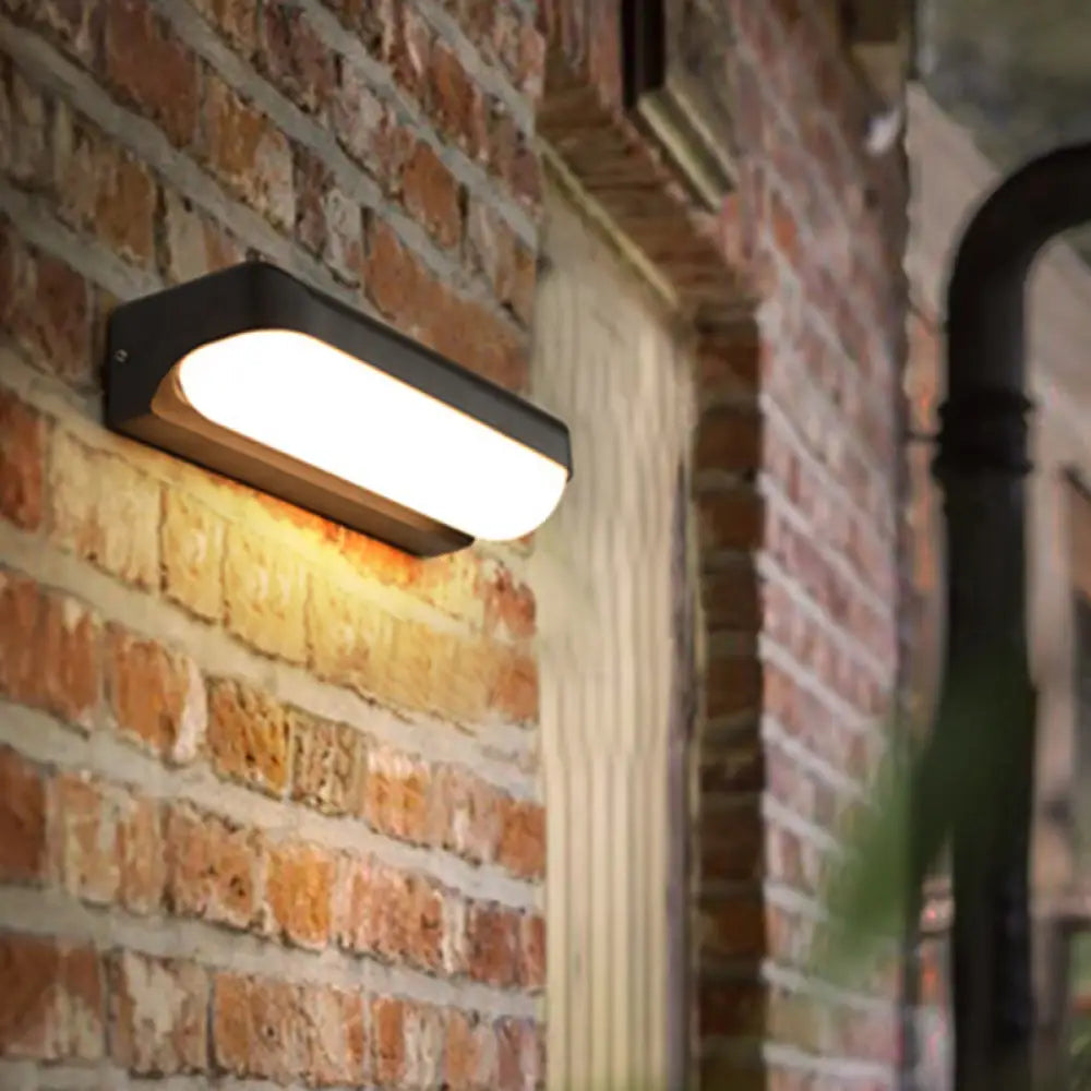 DecorBites™ Modern Black Acrylic Wall Sconce with Flush Capsule Design and Half-Bulb Mounting