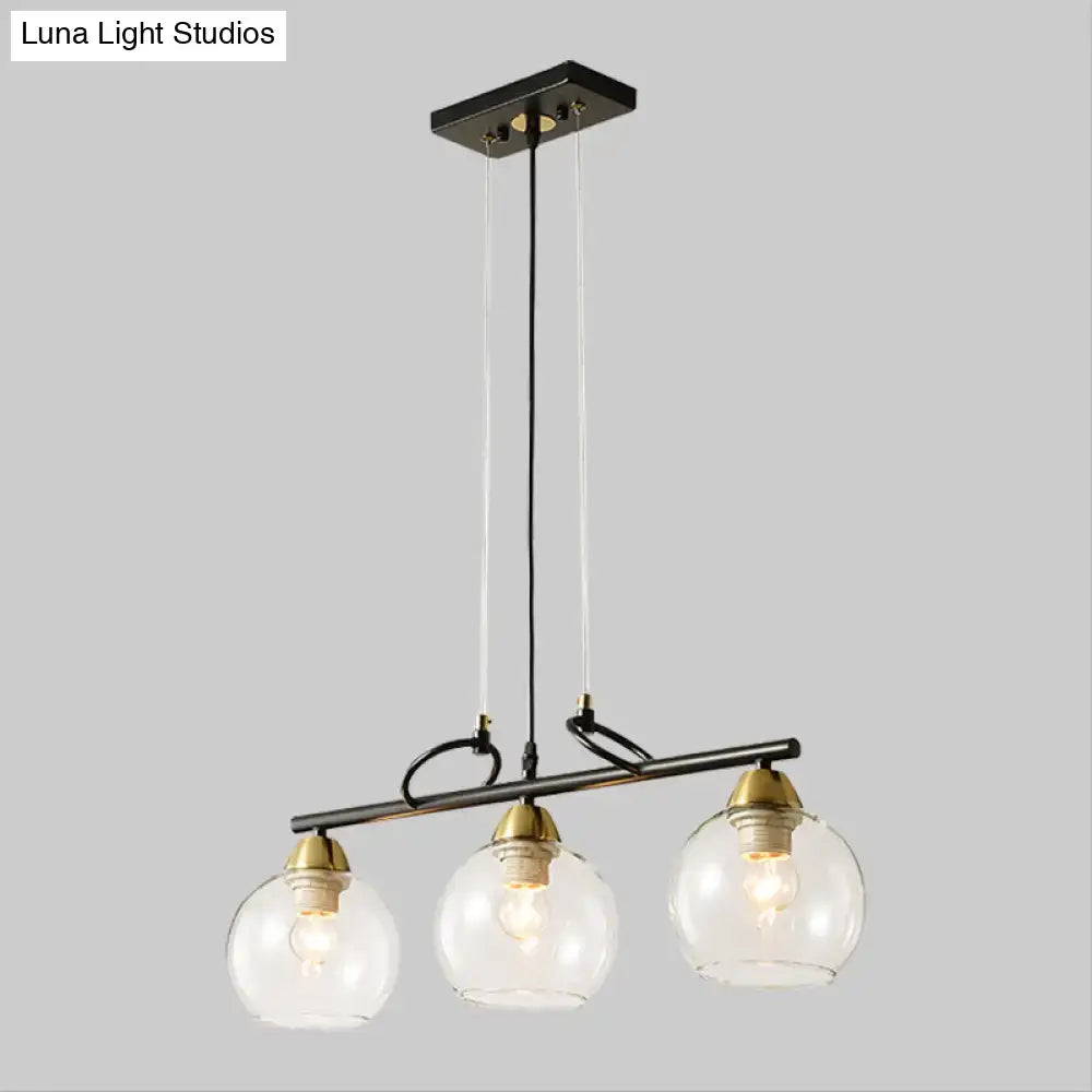 Modern black and brass 3-bulb smoke gray glass pendant dining hall island
