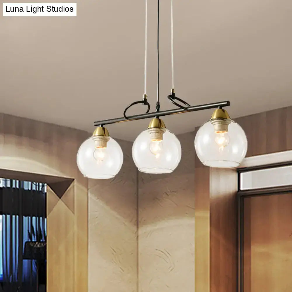 Modern black and brass 3-bulb smoke gray glass pendant dining hall island