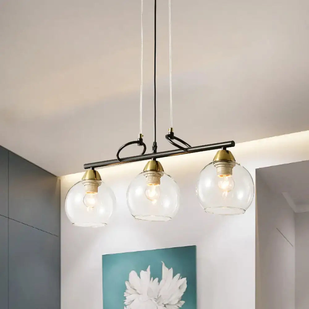Modern black and brass 3-bulb smoke gray glass pendant dining hall island