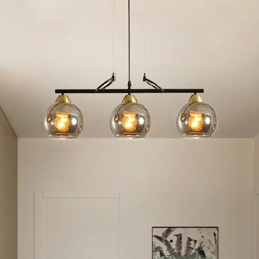 Modern black and brass 3-bulb smoke gray glass pendant dining hall island