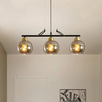 Modern black and brass 3-bulb smoke gray glass pendant dining hall island