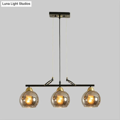 Modern black and brass 3-bulb smoke gray glass pendant dining hall island