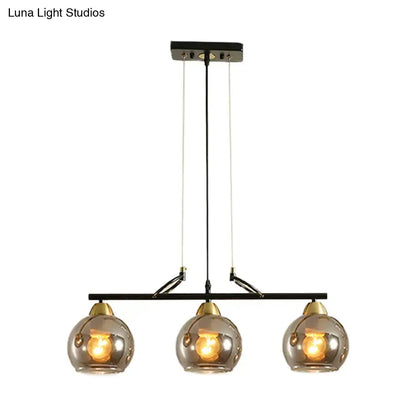 Modern black and brass 3-bulb smoke gray glass pendant dining hall island