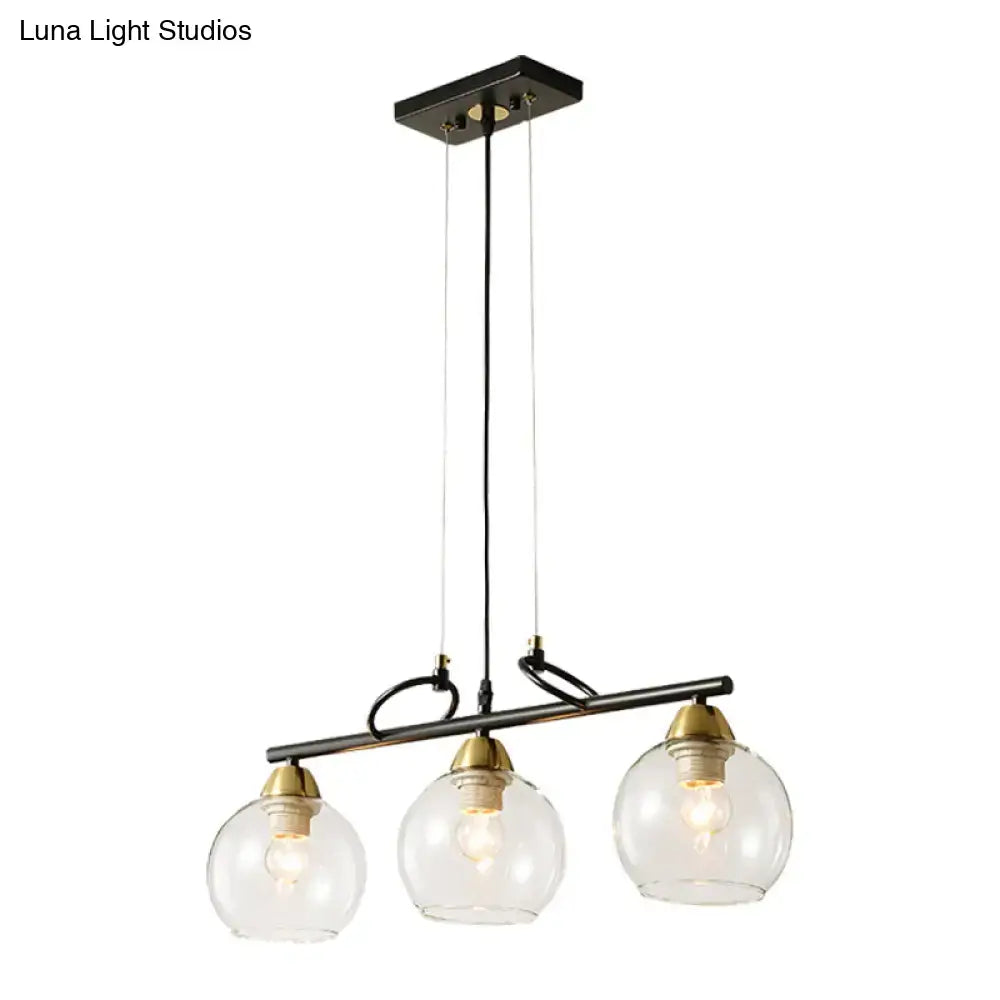 Modern black and brass 3-bulb smoke gray glass pendant dining hall island