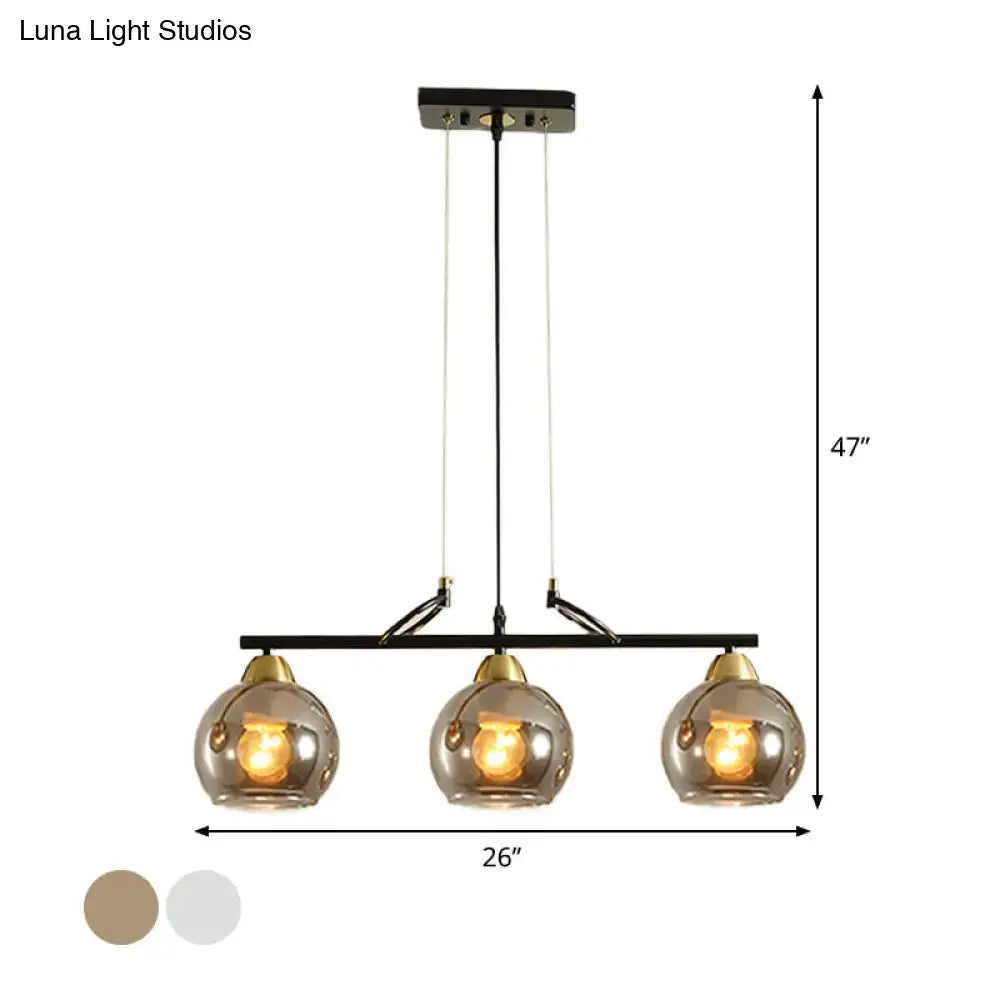 Modern black and brass 3-bulb smoke gray glass pendant dining hall island