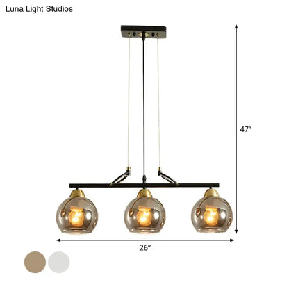 Modern black and brass 3-bulb smoke gray glass pendant dining hall island