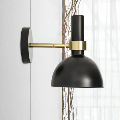 Modern black and brass domed wall lamp for bedroom bedside