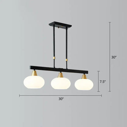Modern black and brass linear hanging lamp with oval opal glass dining room
