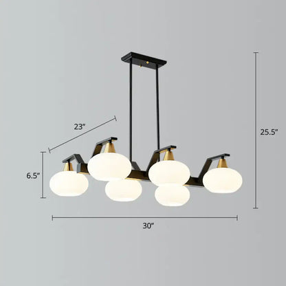 Modern black and brass linear hanging lamp with oval opal glass dining room