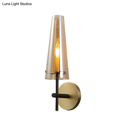 Modern black and brass wall mount light for study room