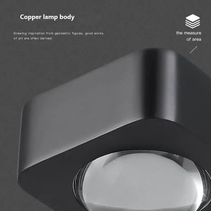 Modern black and copper bedroom wall lamp with glass dome
