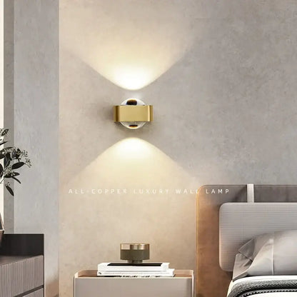 Modern black and copper bedroom wall lamp with glass dome
