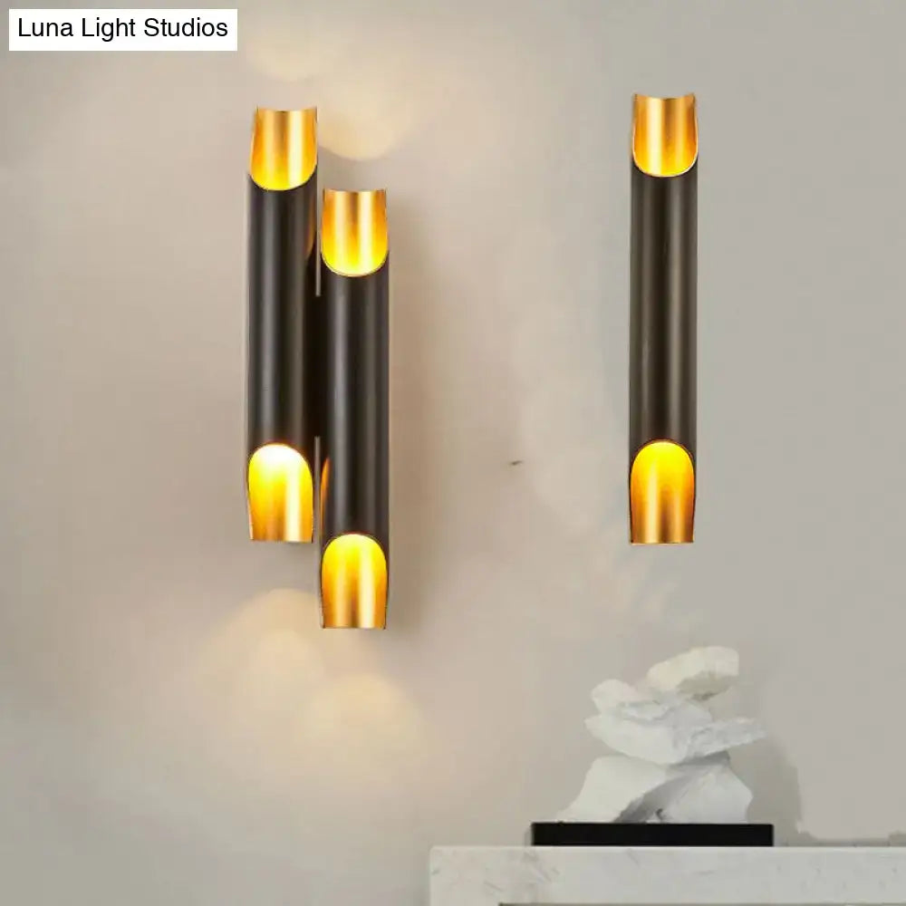 Modern black and gold tubular aluminum wall sconce for living room