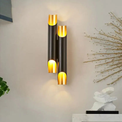 Modern black and gold tubular aluminum wall sconce for living room