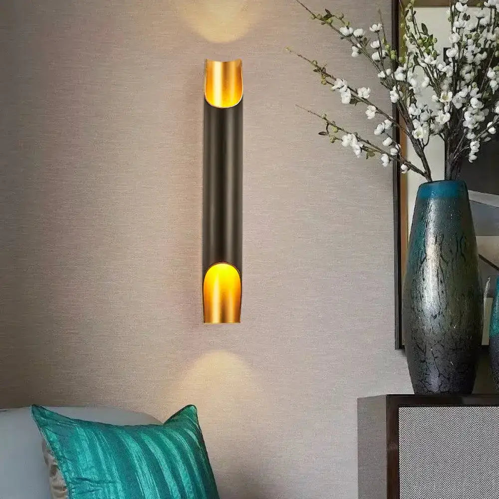 Modern black and gold tubular aluminum wall sconce for living room