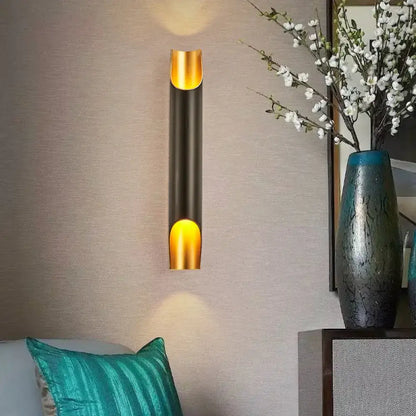 Modern black and gold tubular aluminum wall sconce for living room