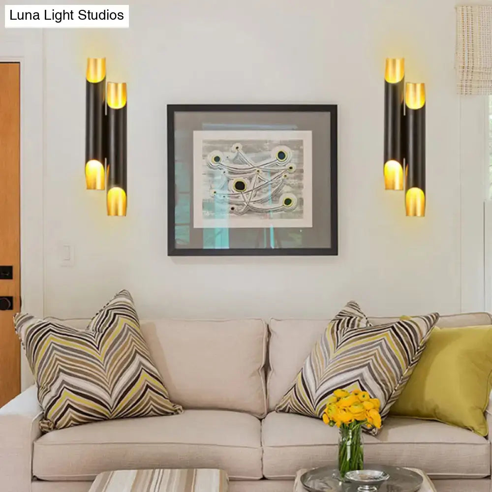 Modern black and gold tubular aluminum wall sconce for living room
