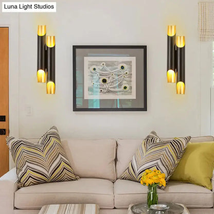 Modern black and gold tubular aluminum wall sconce for living room