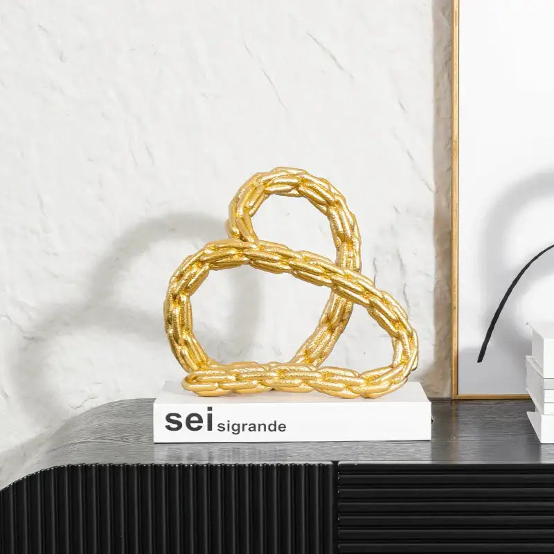Modern black and golden knot chain sculpture living room decor
