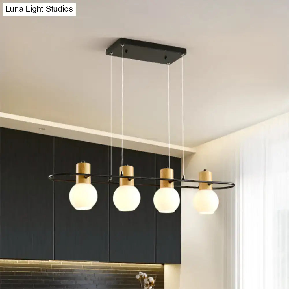 Modern black and wood frosted glass orb pendant light kitchen island
