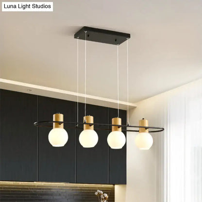 Modern black and wood frosted glass orb pendant light kitchen island