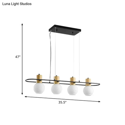 Modern black and wood frosted glass orb pendant light kitchen island