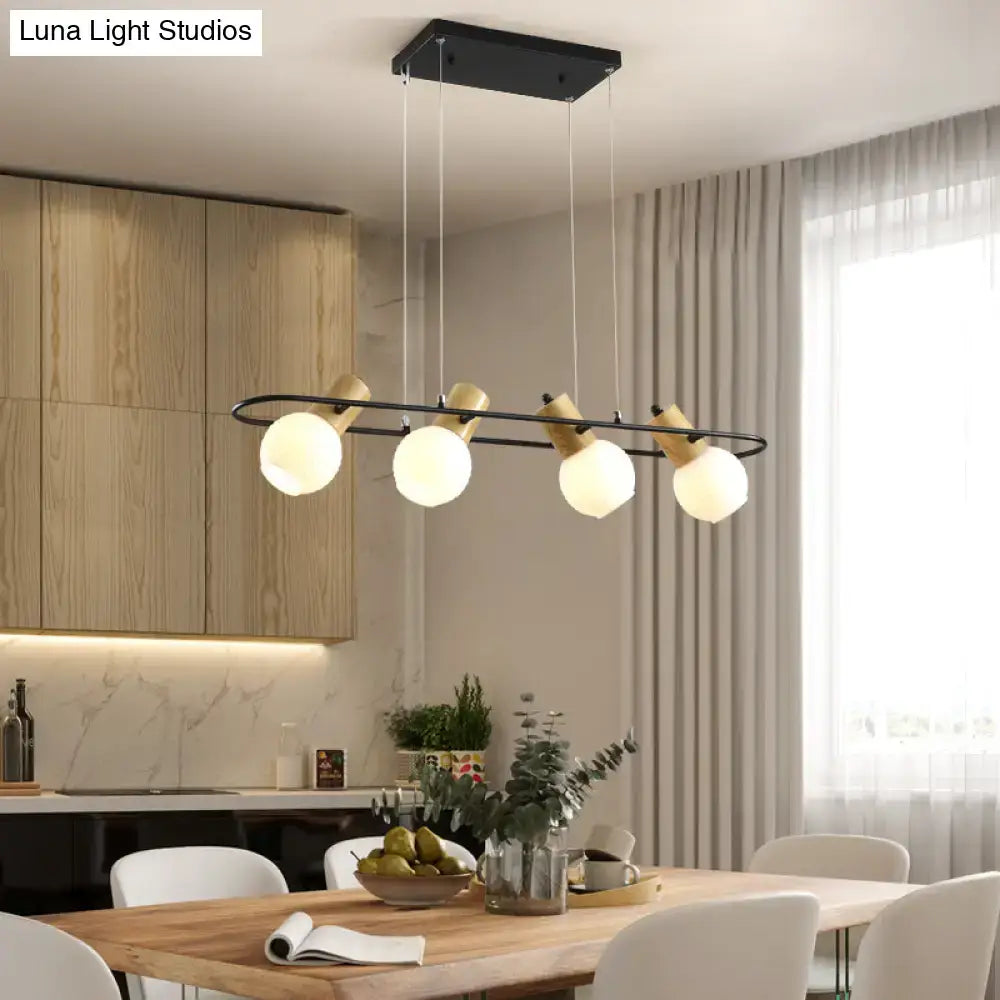 Modern black and wood frosted glass orb pendant light kitchen island
