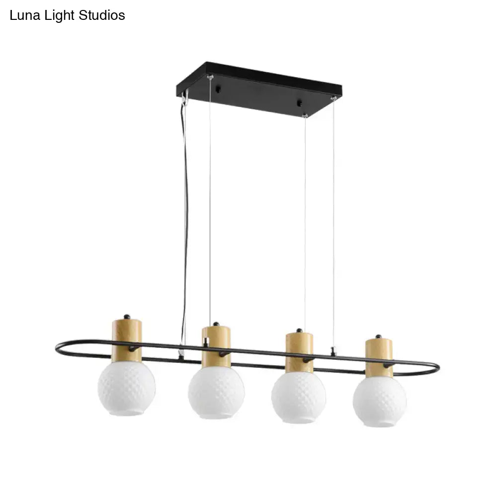 Modern black and wood frosted glass orb pendant light kitchen island