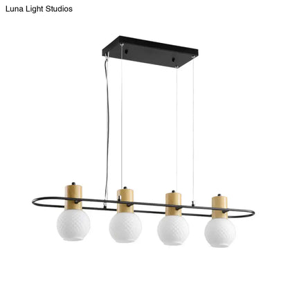 Modern black and wood frosted glass orb pendant light kitchen island