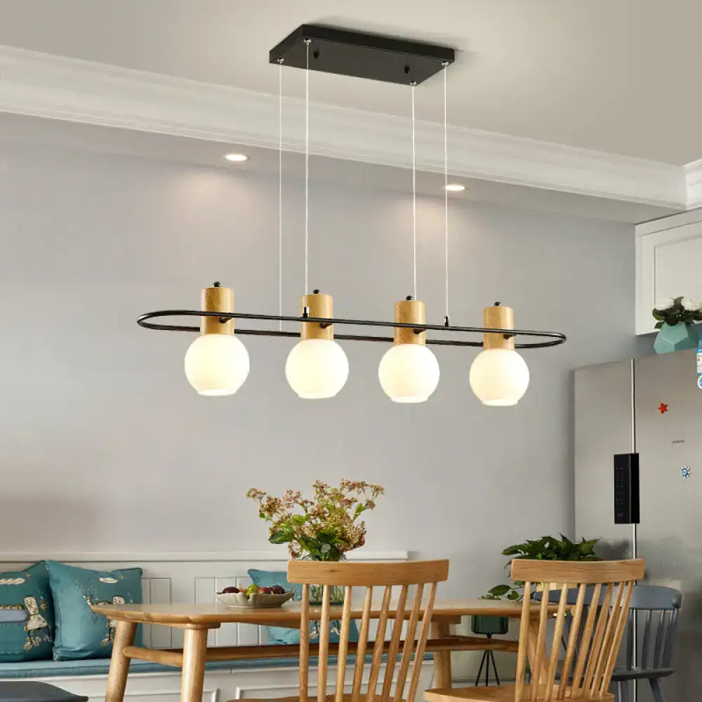 Modern black and wood frosted glass orb pendant light kitchen island