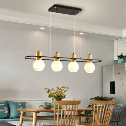 Modern black and wood frosted glass orb pendant light kitchen island