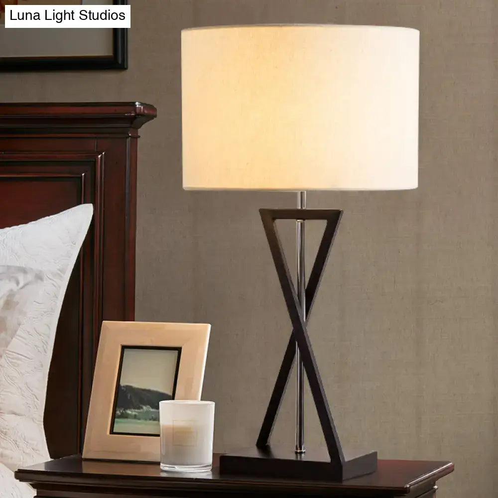 Modern black geometric nightstand lamp with cream drum shade bedroom