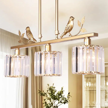 Modern black & gold bird pendant light with clear crystal drum shade