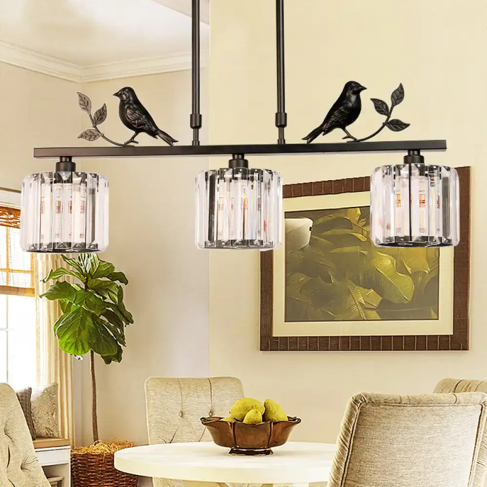 Modern black & gold bird pendant light with clear crystal drum shade