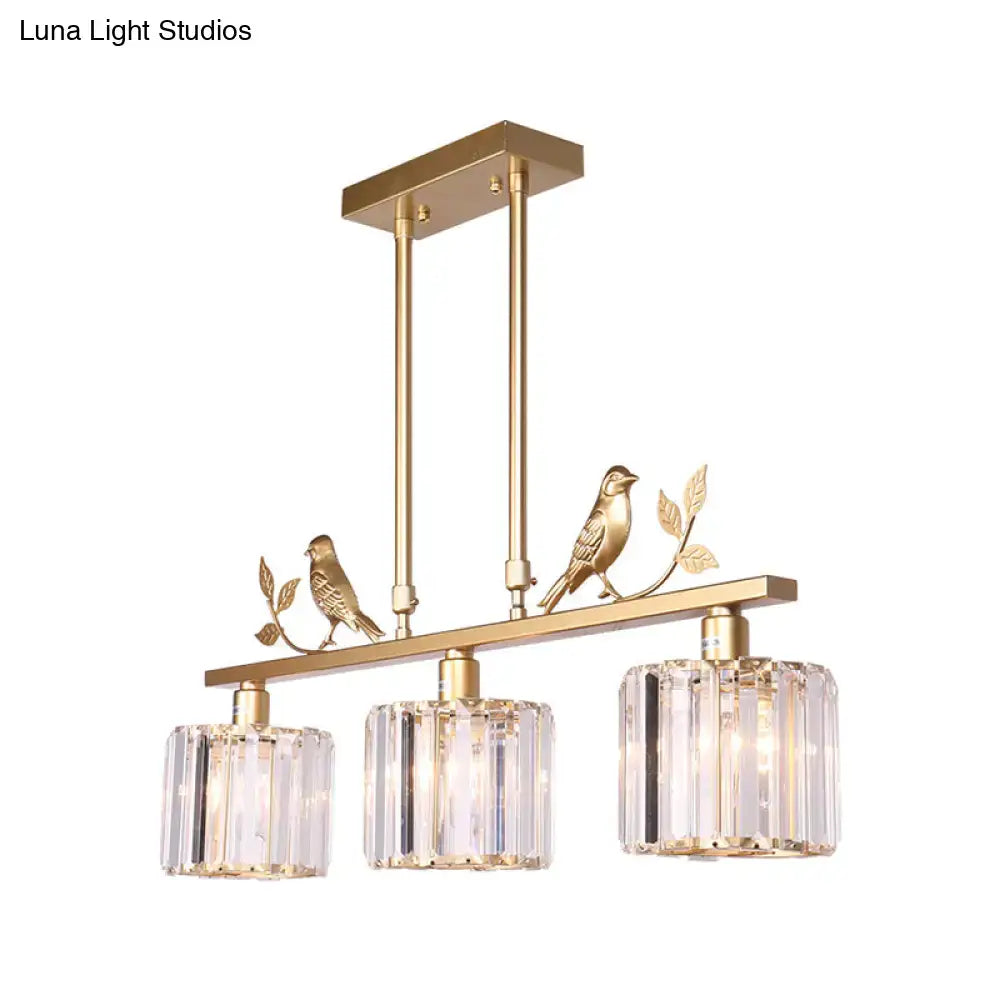 Modern black & gold bird pendant light with clear crystal drum shade