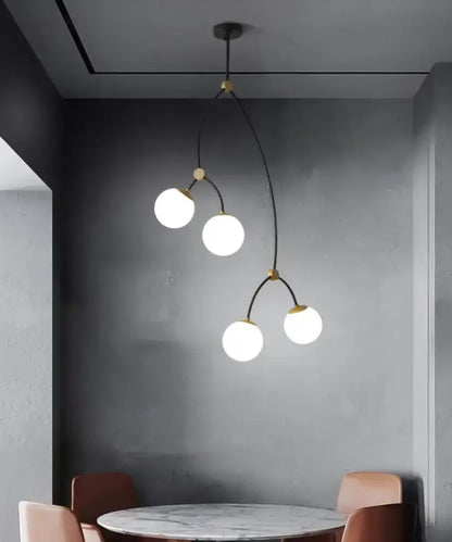 Modern black & gold island light with ball glass shade dining room