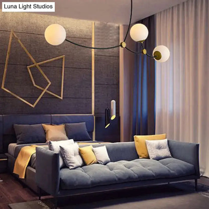 Modern black & gold island light with ball glass shade dining room