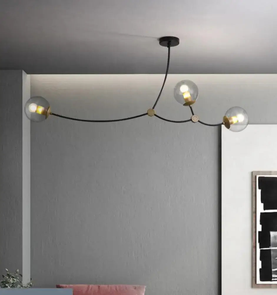 Modern black & gold island light with ball glass shade dining room