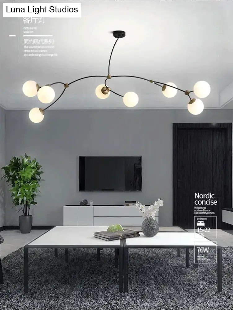 Modern black & gold island light with ball glass shade dining room