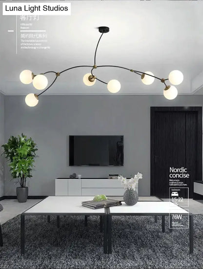 Modern black & gold island light with ball glass shade dining room