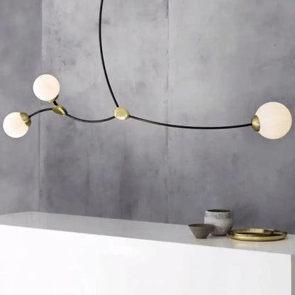 Modern black & gold island light with ball glass shade dining room