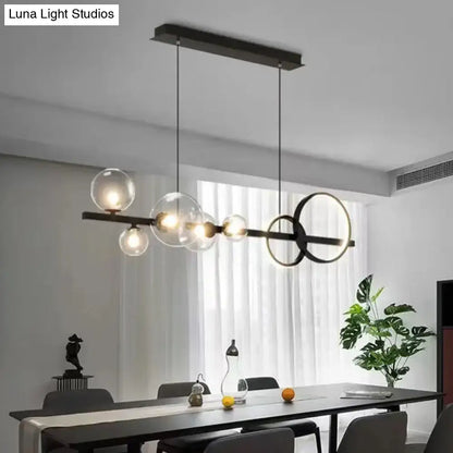Modern black & gold pendant light with clear glass for dining room