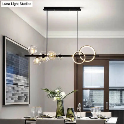 Modern black & gold pendant light with clear glass for dining room
