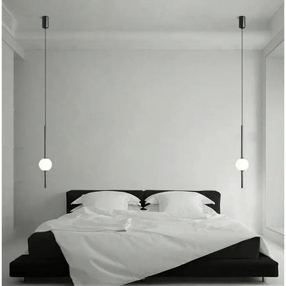Modern black & gold pendant light with glass shade for living room