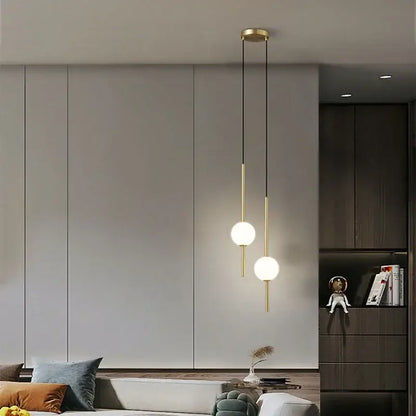 Modern black & gold pendant light with glass shade for living room