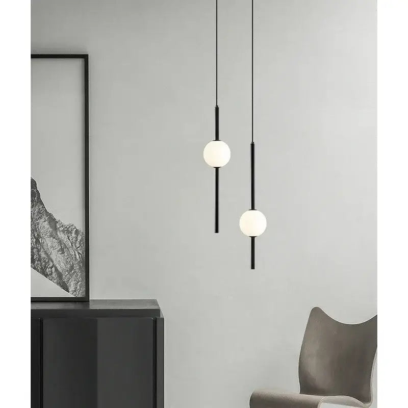Modern black & gold pendant light with glass shade for living room